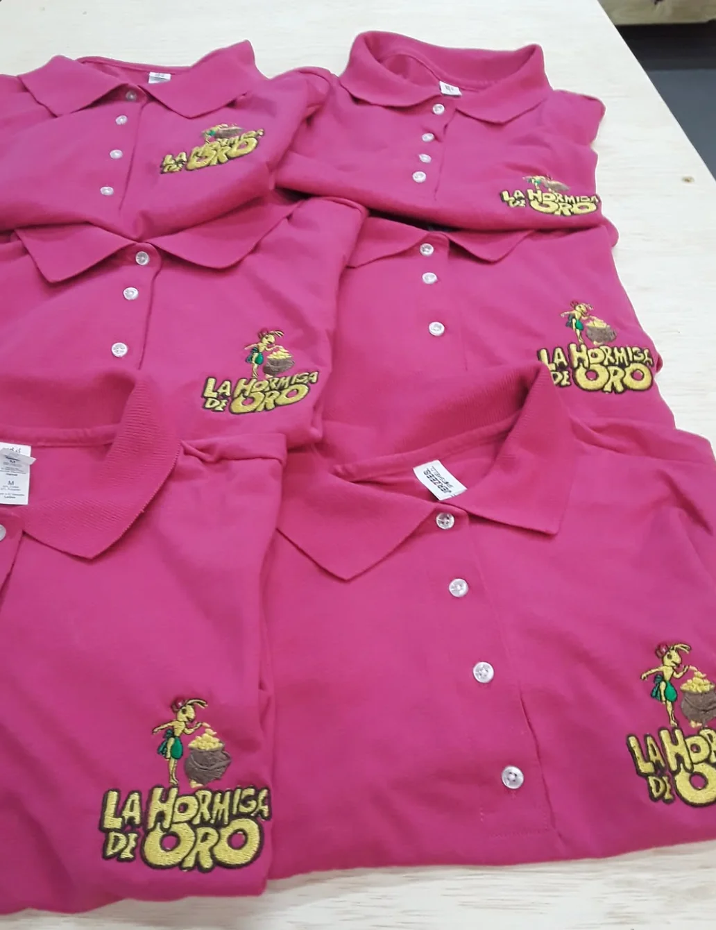 Pink embroidered polo shirts